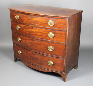 A George III mahogany bow front chest of 4 long drawers with brass drop handles and escutcheons 38 1/2" x 43" x 21 1/2" 