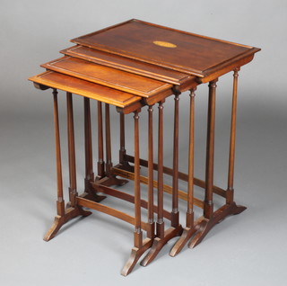 An Edwardian quartetto of mahogany interfitting tables, the top inlaid a cartouche 27" x 24" x 15", 26" x 21 1/2" x 13 1/2", 26" x 19" 12", 25" x 16 1/2" x 11" 