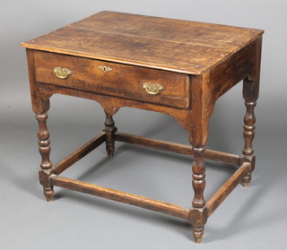 An 18th Century oak side table fitted a frieze drawer and raised on turned and block supports 39"h x 32"w x 24"d 