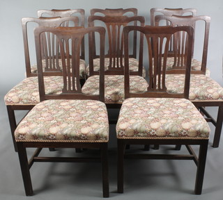 A set of 8 19th Century Hepplewhite style dining chairs with upholstered drop in seats, on square supports with H framed stretcher 