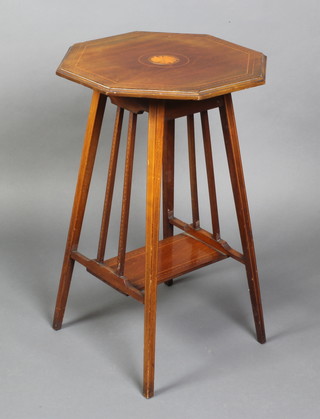 An Edwardian octagonal inlaid mahogany 2 tier occasional table, raised on outswept tapered supports and with rectangular undertier 27"h x 17"w x 17"d 