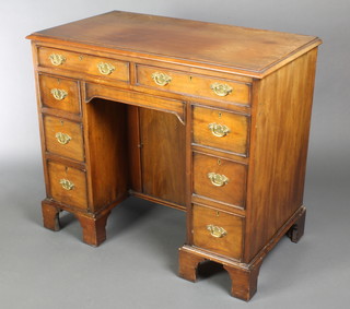 A Georgian style mahogany kneehole pedestal dressing table fitted 2 long drawers above 1 secret drawer and with a cupboard to the pedestal flanked by 6 short drawers, raised on bracket feet 32"h x 36"w x 20"d 