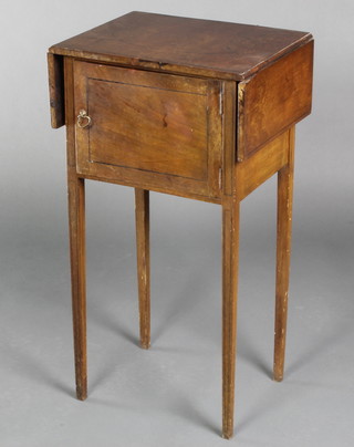 A 19th Century mahogany drop flap pot cupboard with inlaid ebony stringing, the cupboard enclosed by panelled doors, raised on square tapering supports 30"h x 16" when closed by 27" when open x 12"w 