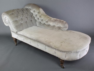 A Victorian chaise longue upholstered in button back grey dralon, raised on turned supports 34"h x 73"l x 29"d 