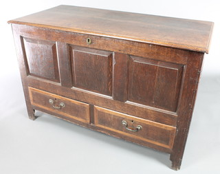 An 18th Century oak mule chest of panelled construction with hinged lid, the interior fitted a candle box, the base fitted 2 drawers with replacement brass swan neck drop handles 32"h x 49"w x 23"d 