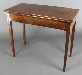 A 19th Century rectangular mahogany tea table of rectangular form, raised on squared tapered supports 30"h x 36"w x 17"d