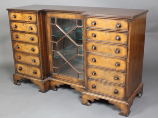 An Edwardian Georgian style inverted breakfront display cabinet flanked by 12 short drawers with tore handles raised on bracket feet 34"h x 54"w x 18"d 