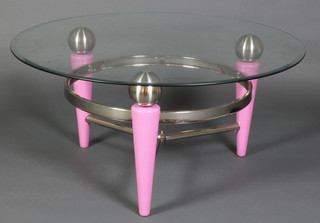 A circular chrome and pink painted metal coffee table with plate glass top 18"h x 38" diam. 