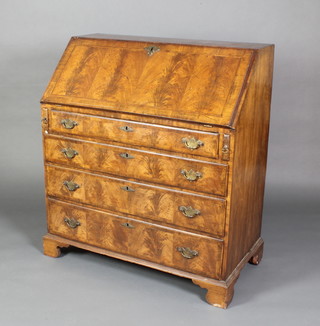 A Queen Anne style walnut bureau with feather banding, the fall front revealing a well fitted interior above 4 long drawers, raised on bracket feet 40 1/2h x 36"w  x 19"d, raised on bracket feet