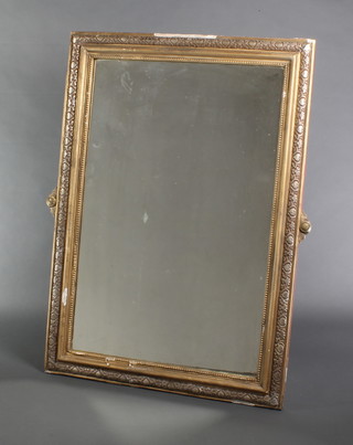 A Continental rectangular plate mirror contained in a decorative gilt frame 49"h x 37"w