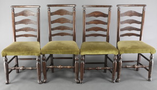 A set of 4 19th Century elm ladder back dining chairs with upholstered seats, raised on turned supports 