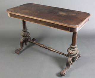 A Victorian rectangular rosewood stretcher table raised on turned supports 28"h x 41"w x 20 1/2"d 