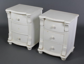 A pair of French style white painted bow front bedside chests of 3 long drawers with fluted columns to the sides, raised on bun feet 23"h x 18"w x 15"d 