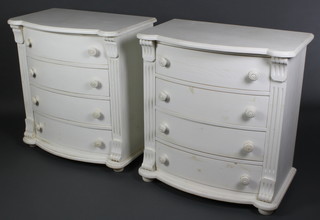 A pair of white painted French style bow front chests of 4 long drawers with tore handles and  fluted columns to the sides, raised on bun feet 33"h x 31"w x 18"d 