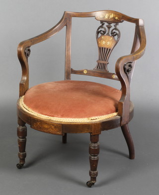 An Edwardian inlaid mahogany tub back chair with vase shaped slat back, inlaid throughout and with pink upholstered seat, raised on turned supports  