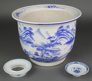 A 20th Century Chinese blue and white jardiniere with extensive landscape decoration 8" together with a stand and dish 