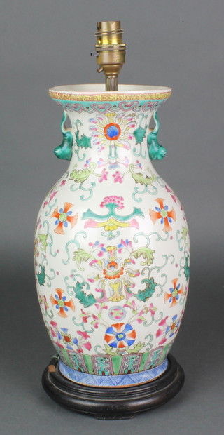 A 20th Century Chinese famille rose baluster vase with lion handles converted to electricity 13" 