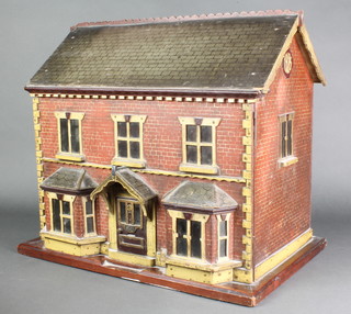 A good 1920's childs wooden polychrome 2 storey dolls house, dated 1925, 17"h x 20"w x 13"d 