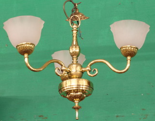 A 3 branch lacquered brass chandelier with opaque glass fluted and reeded shades