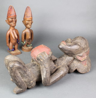 A carved wooden African figure of a kneeling lady 18" and 2 other figures 12" 