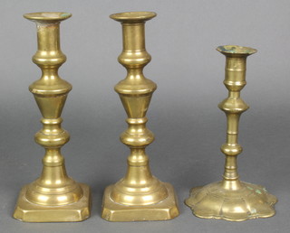 A 17th Century brass candlestick with petal base 8" together with 2 19th Century brass candlesticks 10" (both f)