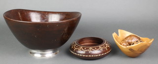 A circular turned wooden bowl raised on a Sterling silver spreading foot 5 1/2" x 12" diam., an Indian circular turned hardwood and inlaid ivory bowl 6 1/2", a turned yew bowl 6" and 3 turned wooden models of items of fruit 