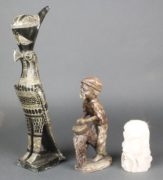 A carved hardstone head and shoulders portrait bust of a bearded gentleman 4", an African carved stone figure of a standing gentleman 8" (head f) and an Egyptian carved hardstone figure of a hawk 15" (beak chipped) 