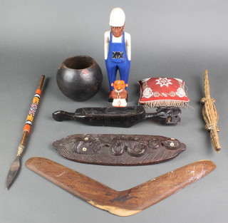 An Australian wooden boomerang, a Maori style plaque decorated figures 13", a small embroidered bead work cushion and other curios etc 