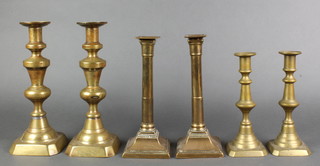 A pair of Victorian brass candlesticks 10" (both with old solder repairs), a pair of Adams style candlesticks with square bodies 9" and a pair of Victorian brass candlesticks with lead weighted bases 8" 