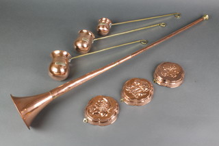 A reproduction copper and brass coaching horn, 3 copper and brass measures marked Whisky, Rum and Brandy together with 3 reproduction jelly moulds 5" 