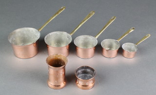 5 Italian copper measures with brass handles 8ozs, 6 ozs, 4 ozs, 2 ozs, 1 ozs, together with 2 brass measures of waisted form marked The Fox Sherry, the bases marked E Todd 1881  