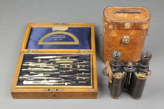 Ross of London, a pair of field glasses marked no. 2807 complete with leather carrying case together with a geometry set "The Technical Case no. 112" contained in an oak case 