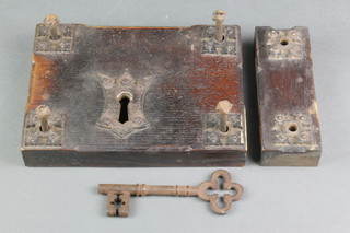 Hart & Sons of Wych Street London, a 19th Century iron door lock contained in an oak iron bound housing 6" x 10" complete with key and 4 retaining screws 