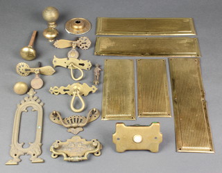 A brass door bell push, various finger plates etc 
