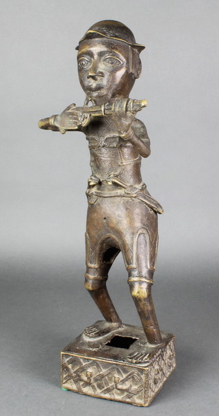 A  Benin bronze figure of a standing man with rifle on a square base 18" 