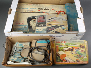 A Minic motor rally motor racing game M/1516 boxed (box damaged), ditto hump back bridge boxed, ditto track and various cars 