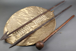 A knob kerry 26 1/2", an oval Zulu shield 28" and 2 wooden spears