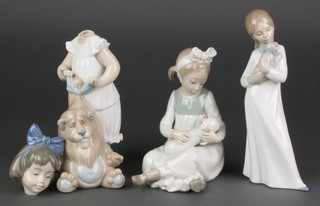 A Nao figure of a girl with puppy 7 1/2", a ditto of a girl with bowl 6" and a child with toy bear 8" 