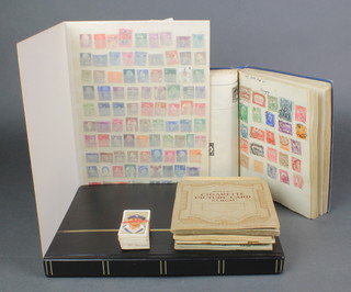 An Improved stamp album containing a collection of various 1930's and later stamps, 2 stock books and various mint and used stamps, a Wills cigarette card album - Health and Safety and 2 others - Road Safety, Railway Engines and 1 other and a Players album - Kings and Queens 