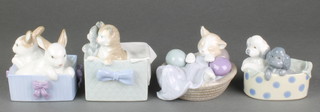 A Nao group of 2 kittens in a box 4", ditto of a cat in a basket 5", a ditto of 2 rabbits in a box 3" and 2 puppies in a box 3" 
