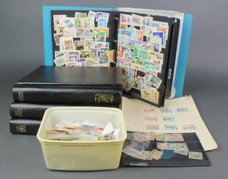 3 stamp albums of used world stamps - Aidan, Belgium, Hungary, Hong Kong, Canada, Nigeria, an album of various used world stamps and a collection of loose world stamps 
