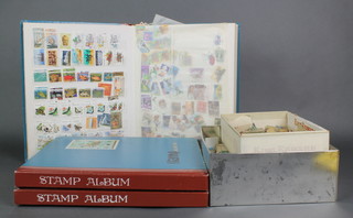 3 stock books of World stamps and 2 shallow boxes of loose stamps