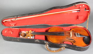 A violin with 1 piece back bearing label Joseph Guarnerius Fecit Cremonae Anno 1741, having a 14" back (slight scratches to the back), complete with bow and wooden carrying case