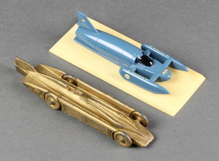 A model of Henry Seagrave Golden Arrow racing car with a model The Bluebird Mk 7