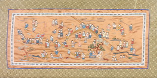 A framed Chinese silk work embroidery of figures at pursuits 12" x 25" 