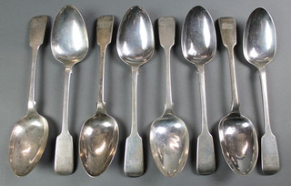 A set of 8 Victorian Irish silver fiddle pattern table spoons with engraved monogram, Dublin 1895, 594 grams 