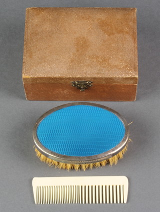 A silver and guilloche enamel hairbrush, cased with a comb, Birmingham 1928