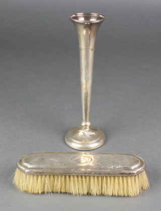 A silver tapered spill vase Birmingham 1972, 8 1/4" and a silver clothes brush 