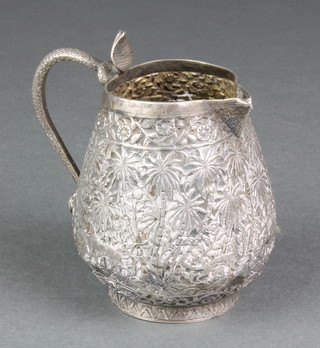An Indian repousse silver jug with animals in a forest setting and serpent handle 144 grams 3 1/2" 