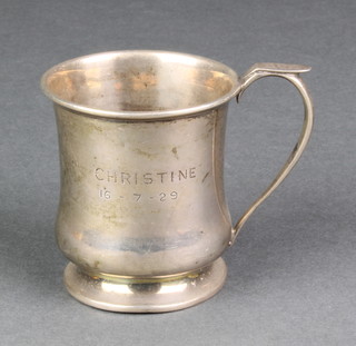 A silver baluster christening mug of plain form with engraved inscription, Birmingham 1929, 64 grams